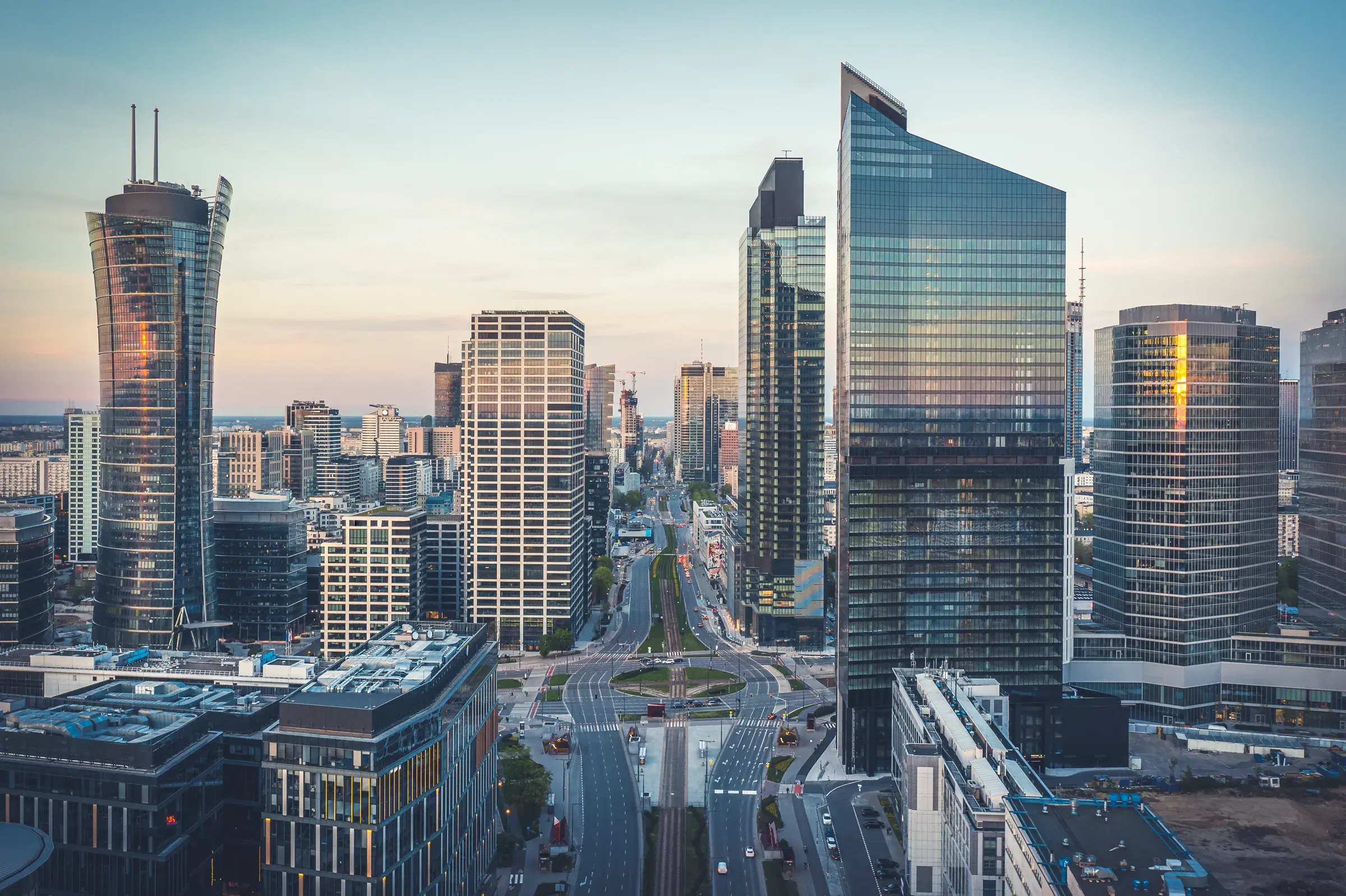 The Warsaw business district at dusk, seen from among its towers.